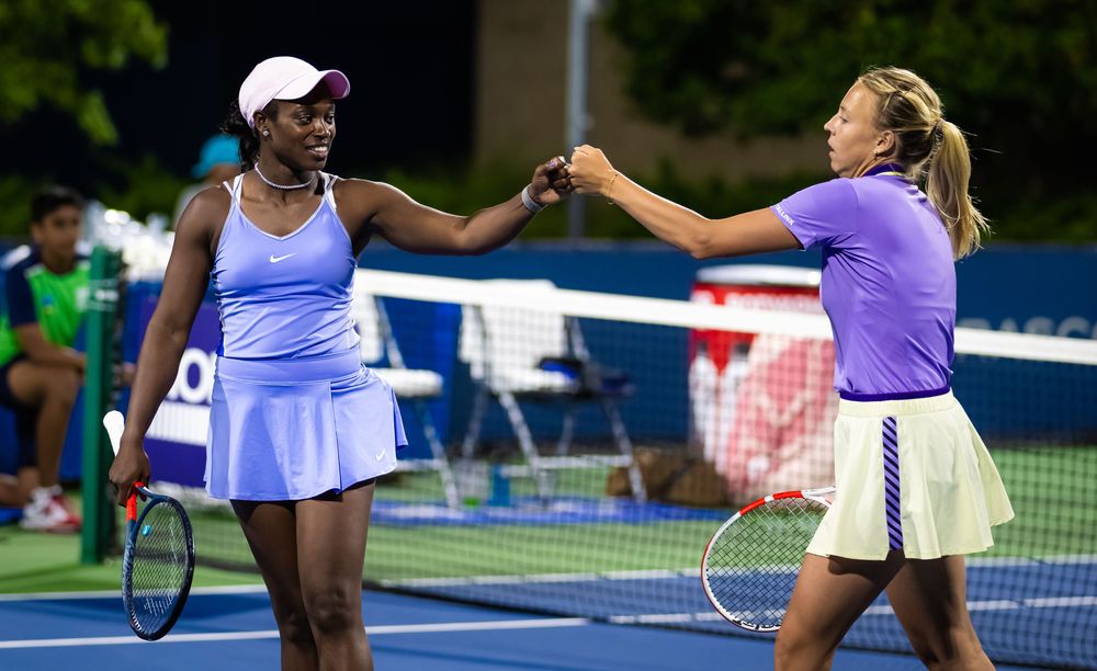 Day 3: First-time doubles pairing Sloane Stephens and Anett Kontaveit bump fists during their second-round loss to Desirae Krawczyk and Demi Schuurs.