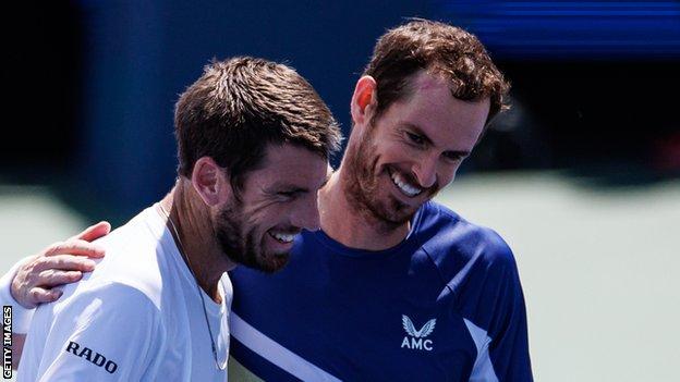Cameron Norrie and Andy Murray smile after their Cincinnati Open match