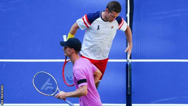 Neal Skupski (top) and Joe Salisbury (bottom) wore a black ribbon and armband respectively in tribute to Queen Elizabeth II