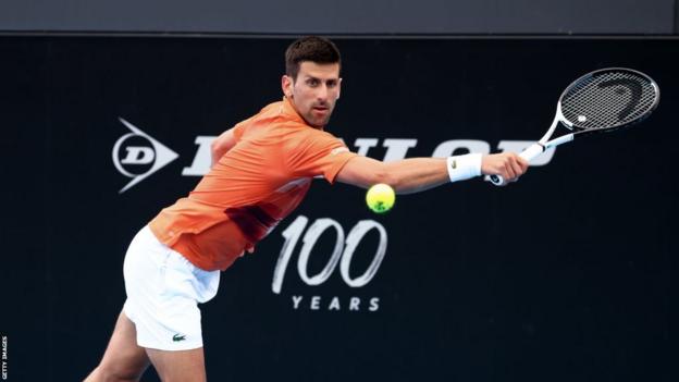 Novak Djokovic of Serbia plays a backhand during the Adelaide International tennis match between Novak Djokovic and Quentin Halys