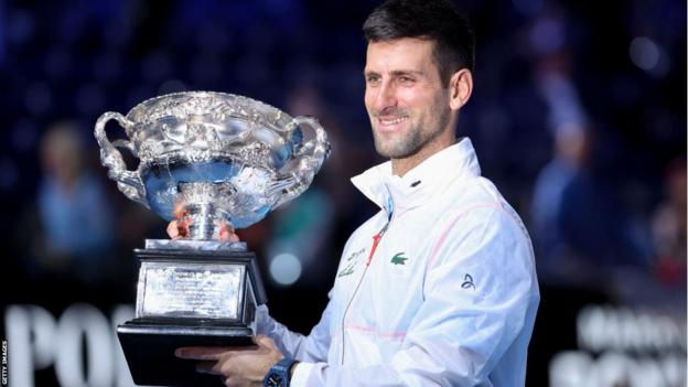 Novak Djokovic holding the Australian Open trophy