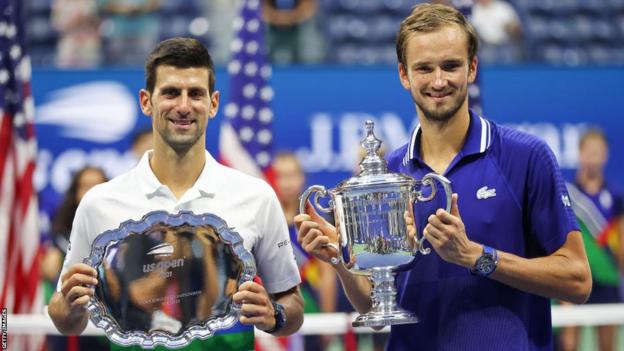 Novak Djokovic and Daniil Medvedev with their trophies after Medvedev beat Djokovic in the US Open final in 2021