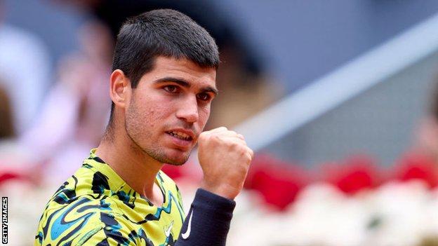 Carlos Alcaraz celebrates winning a point against Emil Ruusuvuori at the Madrid Open