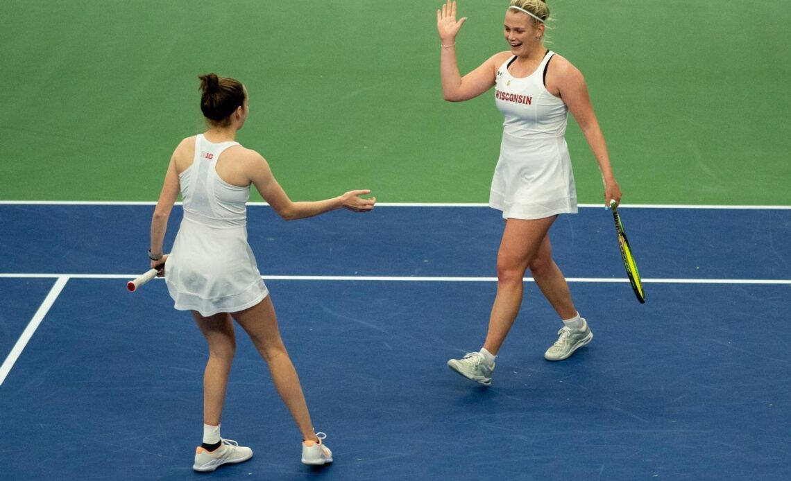 Markham and Sholokhova celebrate during their doubles match