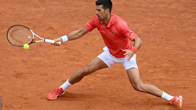 Novak Djokovic goes for a forehand