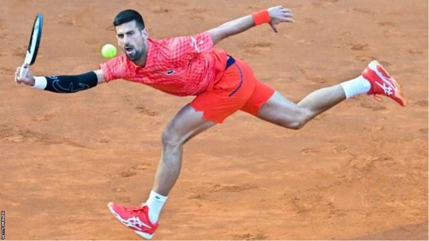 Novak Djokovic stretches for a ball at the 2023 Italian Open