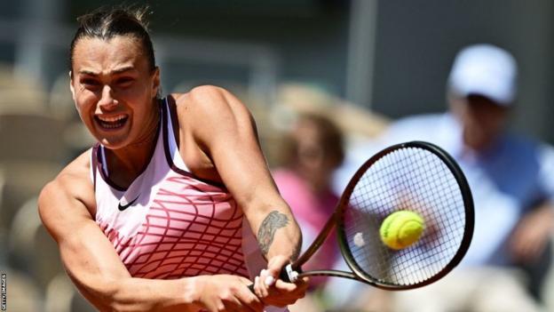 Aryna Sabalenka plays a backhand