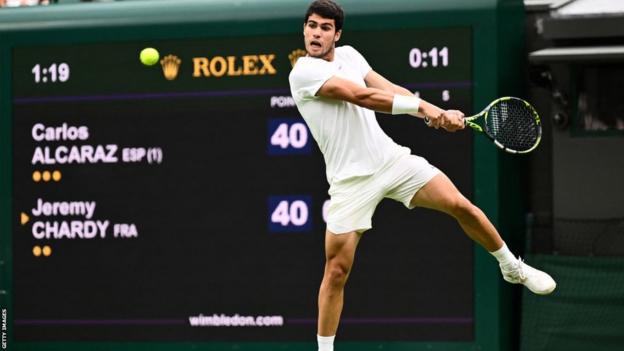 Carlos Alcaraz in action at Wimbledon