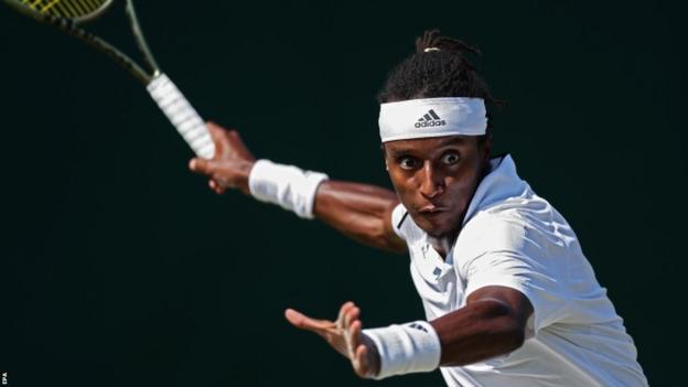 Mikael Ymer playing at Wimbledon in 2023