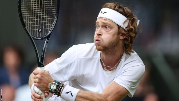 Andrey Rublev hits a backhand shot