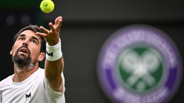 Jeremy Chardy serving