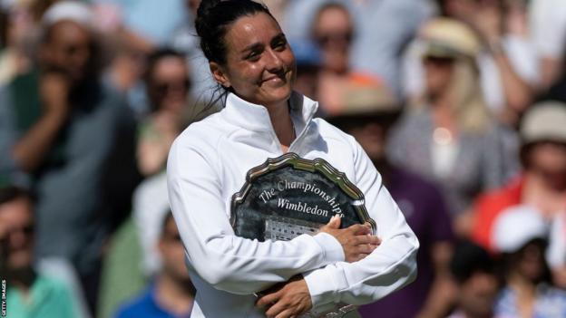 Ons Jabeur with last year's Wimbledon runners-up trophy