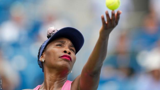 Venus Williams serves during her match against Veronika Kudermetova at the Western and Southern Open