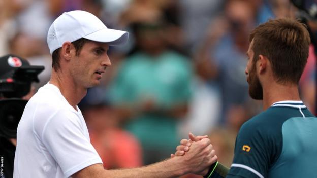 Andy Murray shakes hands with Corentin Moutet after their US Open first-round match