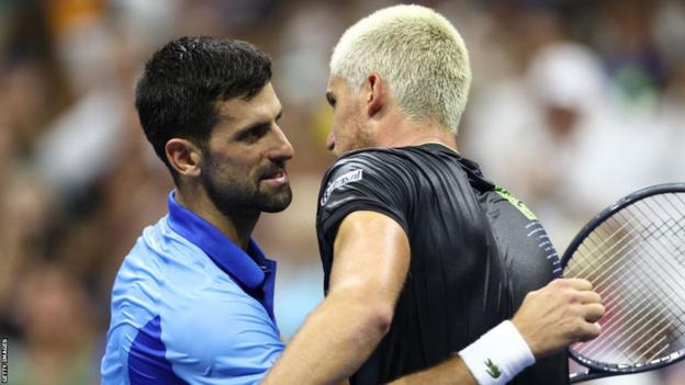 Novak Djokovic hugs Borna Gojo after their US Open match