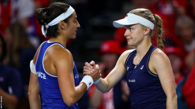 Harriet Dart shakes hands with Caroline Garcia following their Billie Jean King Cup match in Aoril 2023