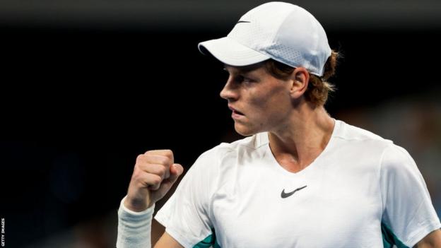 Jannik Sinner clenches his fist in celebration during the China Open semi-final