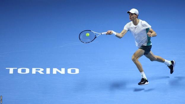 Jannik Sinner plays a forehand