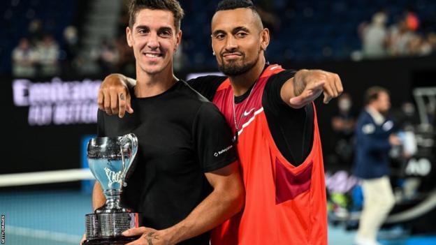 Nick Kyrgios with fellow Australian Thanasi Kokkinakis after winning the Australian Open doubles title in 2022