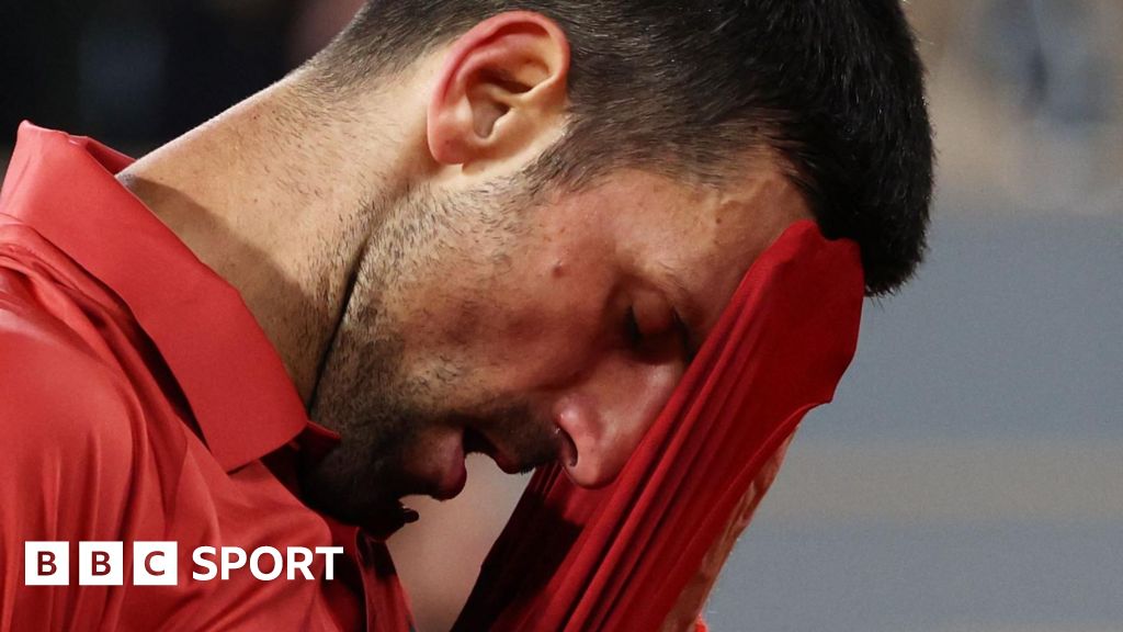 Novak Djokovic wipes his brow at the French Open