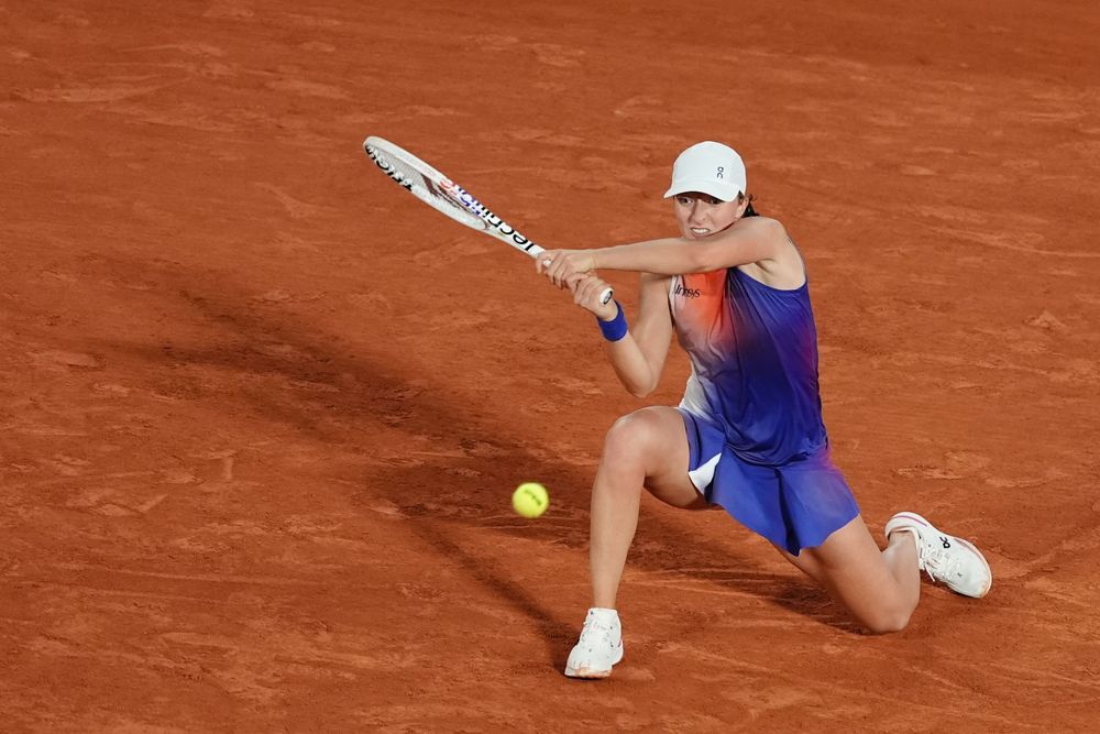 A clash of four-time major champions in the second round of Roland Garros saw Iga Swiatek come from 5-2 down in the decider against Naomi Osaka to win 7-6(1), 1-6, 7-5, saving one match point as Osaka served at 5-4.